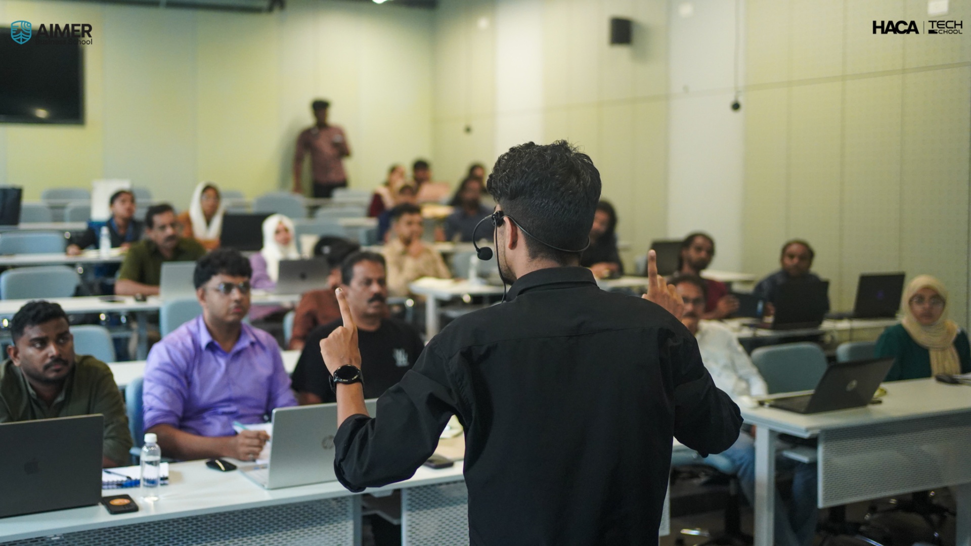 Muhammed Nazil K presenting a session to a full classroom