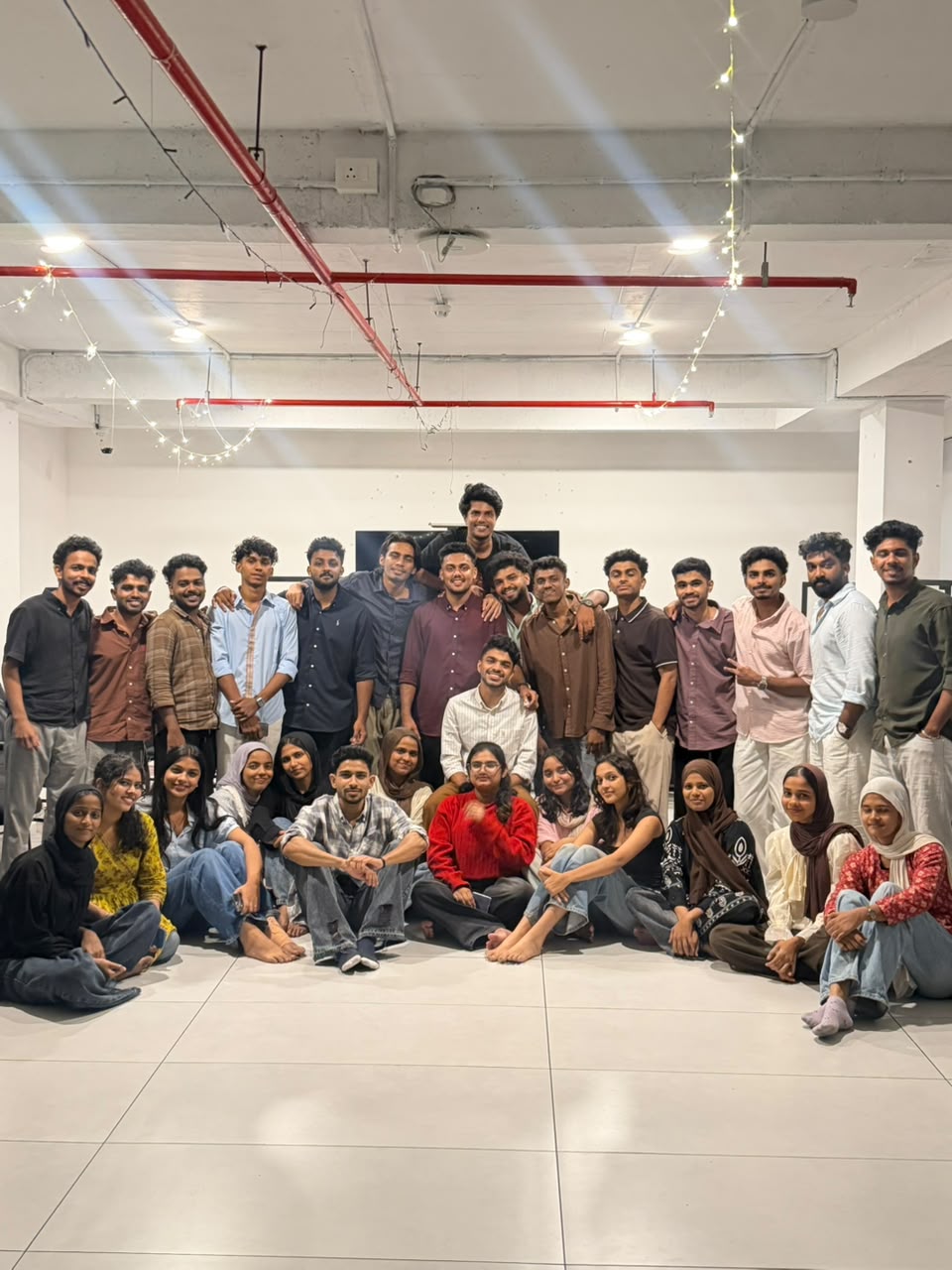 Group photo of Muhammed Nazil K with students after a session