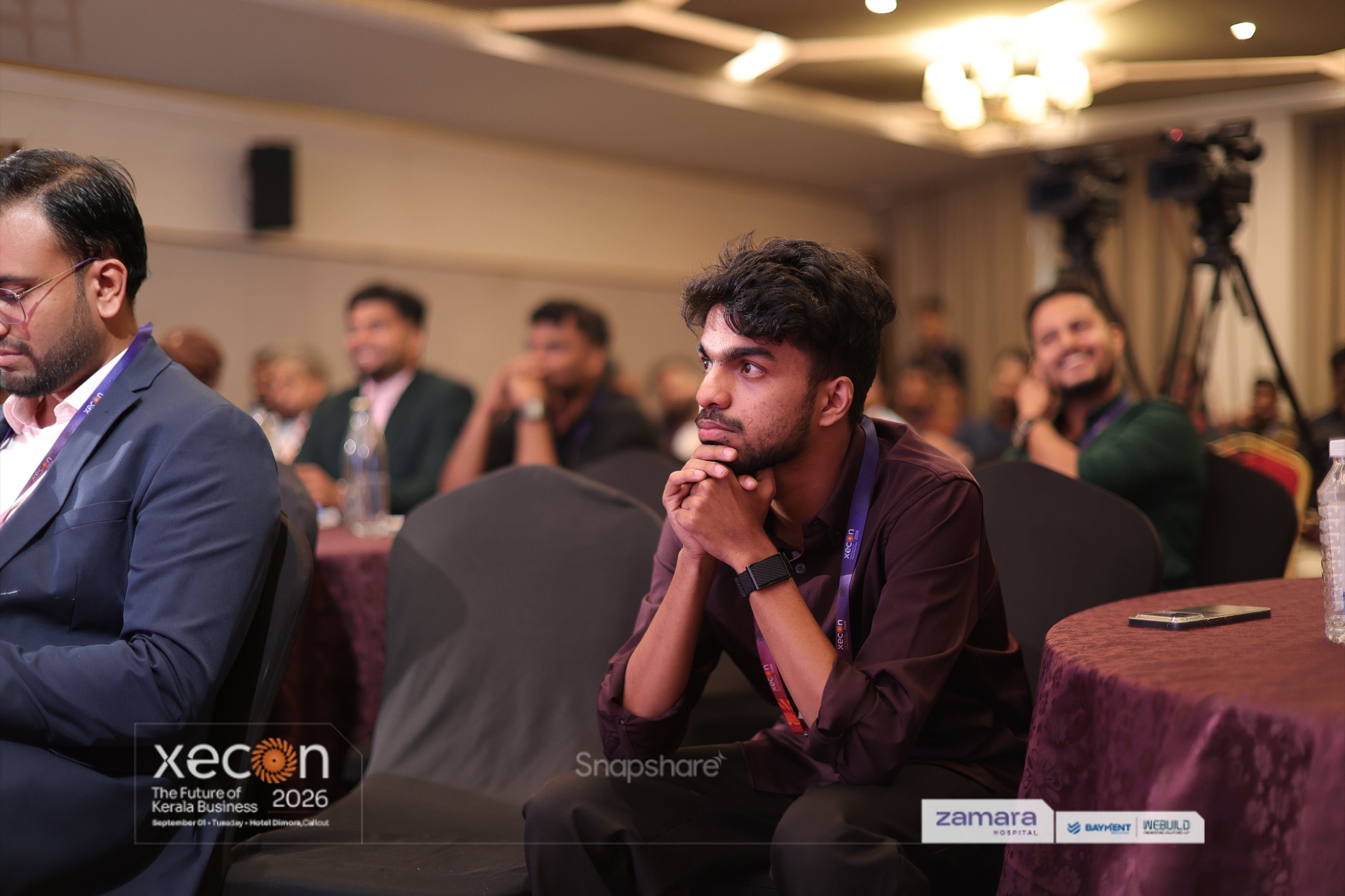 Muhammed Nazil K attending a conference with other participants